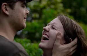 Man cupping a woman's ears