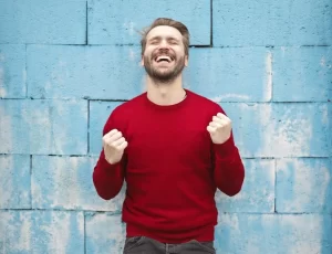 Happy man in red sweater