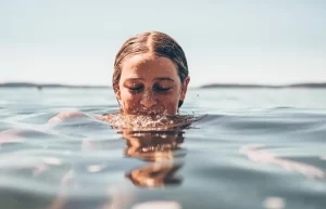 Woman swimming in the water