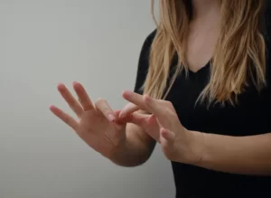 Woman using sign language to communicate
