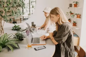 Two woman working on laptops