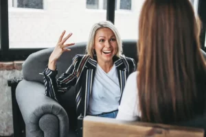 Two woman talking and laughing