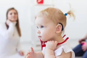 Small child with a hearing aid