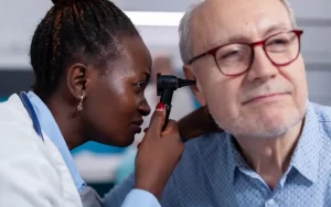 Doctor checking a patient's ear